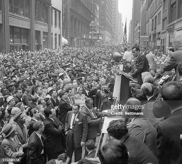 Jamaican-American singer, actor and activist, Harry Belafonte addresses a large crowd at a Civil Rights rally on West 38th Street between 7th and 8th...
