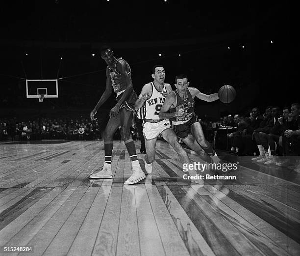 Knicks vs. Pistons. Madison Square Garden. New York, New York: Richie Guerin of the Knicks and Gene Shue of the Pistons fight for the ball. November...