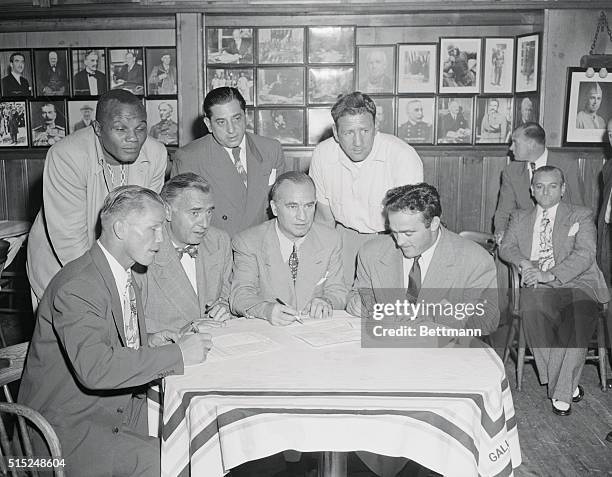 New York: Fight Signing. Gallaghers Steak House 52nd Street. Photo shows L to R front Tony Zale, Abe Greene, , Andy Neiderreiter, , and Marcel...