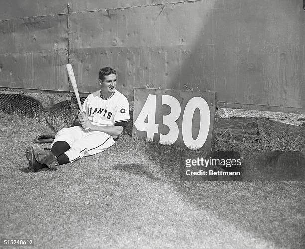 Sports Baseball. Giants. Spring Training. Phoenix, Arizona: Bobby Thomson resting in centerfield and looking at sign in centerfield 430-foot mark...