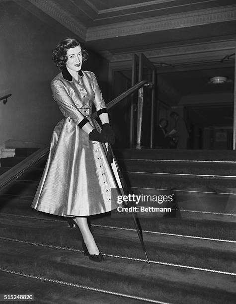 "Dimes" in Fashion. Manhattan, New York, New York: Actress Sarah Churchill does full justice to smart silver and black checkered evening costume in...