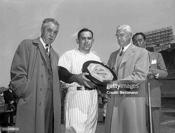 New York, New York: Yankee Opener at Stadium. Photo shows Yogi Berra receiving Most Valuable Player award. L to R--Ford Frick, Yogi Berra, Will...