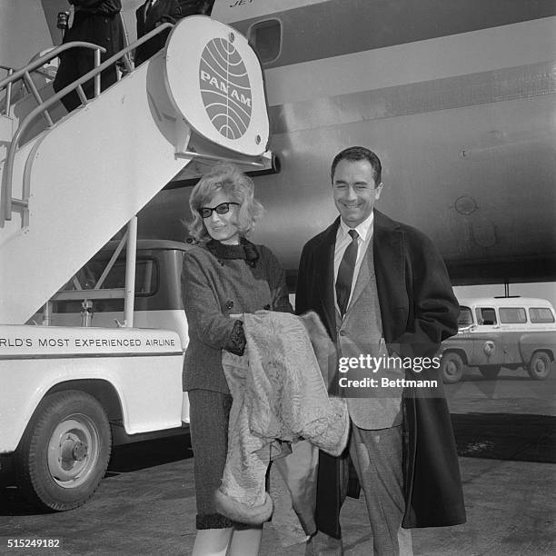 This photo shows here with Director producer Michelangelo Antonioni for the premier of the film Adventures, none other than Monca Vitti.