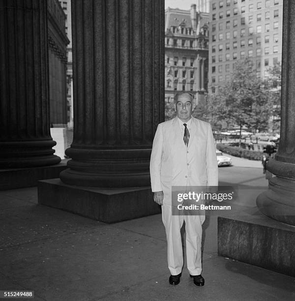 Robert Moses, , is shown here in a full length photo. He is New York's builder of parks and parkways.