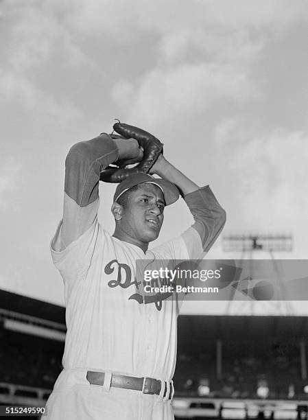 Brooklyn Dodgers pitcher, Don Newcombe, prepares to pitch during 1949 game.