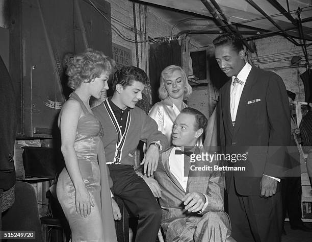 Popular DJ Alan Freed is surrounded by Jo Ann Campbell, Frankie Avalon, Inga Freed and Nate Nelson of the Flamingoes. Alan Freed is seated in the...