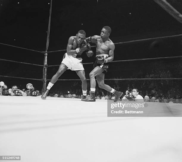 New York: Williams-Carter. Madison Square Garden. Ike Williams , hits challenger James Carter.