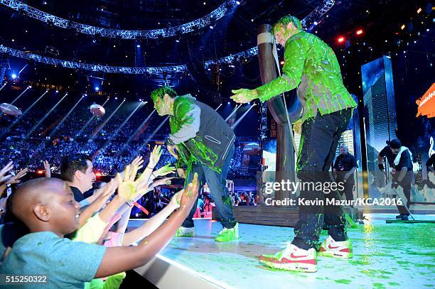 Actors Josh Gad and Jason Sudeikis greet fans after getting slimed during Nickelodeon's 2016 Kids' Choice Awards at The Forum on March 12, 2016 in...