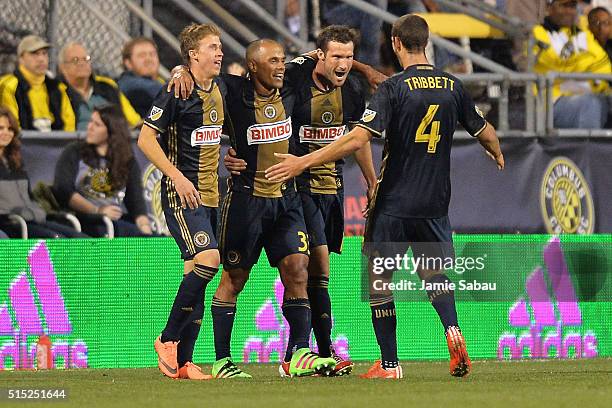 Brian Carroll, Fabinho and Ken Tribbett, all of the Philadelphia Union, celebrate with Chris Pontius of the Philadelphia Union after Pontius scored...