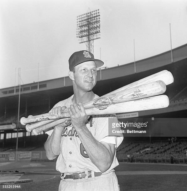 That Man Stan. New York, New York: Stan Musial goes along with the gag and lifts four bats after belting four consecutive homers at the Polo Grounds....