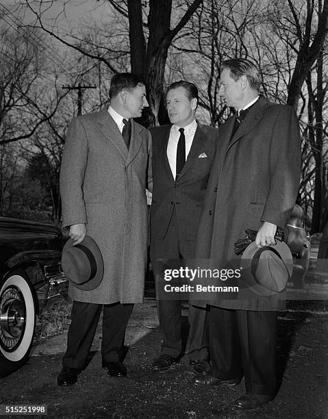 David, Nelson, and Lawrence Rockefeller converse outside a polling place in Pocantico Hills, New York.