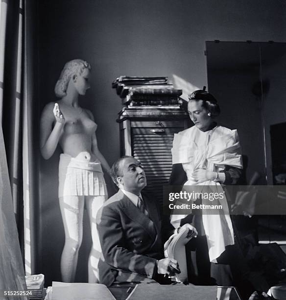 Marcel Rochaix Parisian designer Marcel Rochas collaborating with his wife. News Photo ...