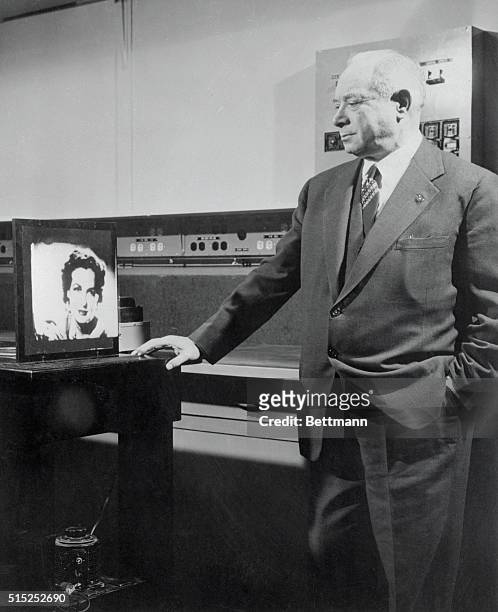 Brigadier General David Sarnoff, Chairman of the Board of the Radio corporation of American, watches a demonstration of the RCA Electronic Light...