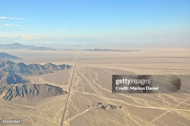 arial view of panamericana sur and nazca plain - arial desert stock-fotos und bilder