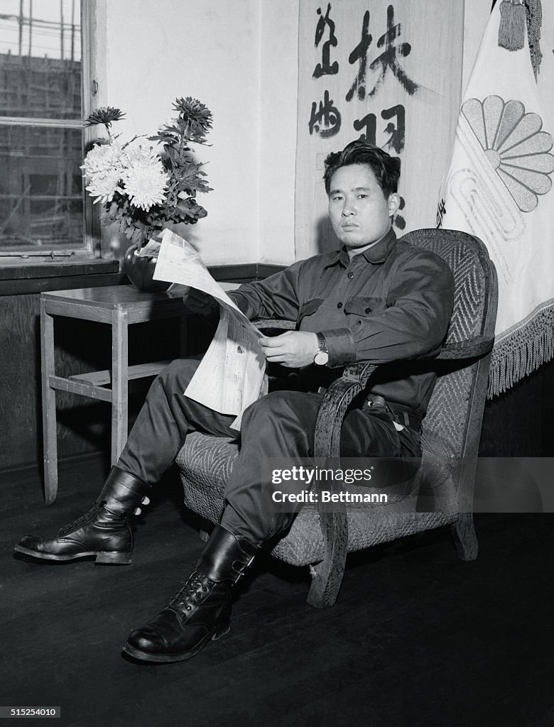 Takeshige Toyada Sitting in a Chair