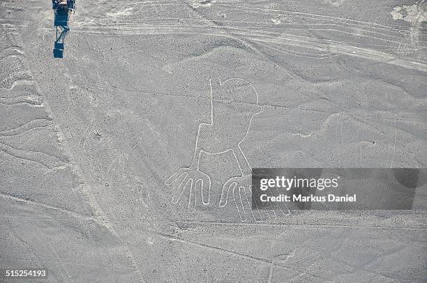 closeup arial view of "hands" nazca lines - arial desert stock pictures, royalty-free photos & images