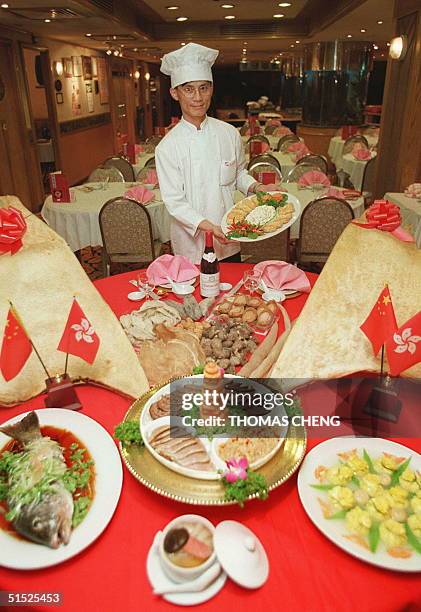 Head chef of the Floata Chiuchow Restaurant, Joe Lau shows some of the dishes of the 1997-Menu 19 April. The HK$1997 eight-course banquet includes a...