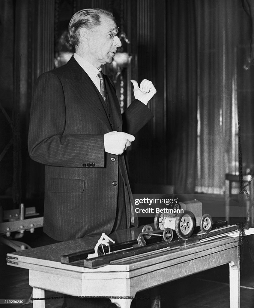 Harry Ferguson with Tractor Model