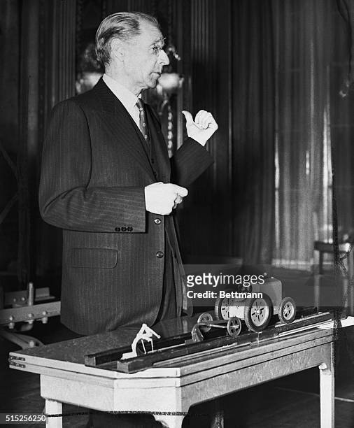 January 22, 1948 - London, England: Harry Ferguson, the man who is suing the Ford Motor Company for $251 000, is shown as he demonstrated a model of...