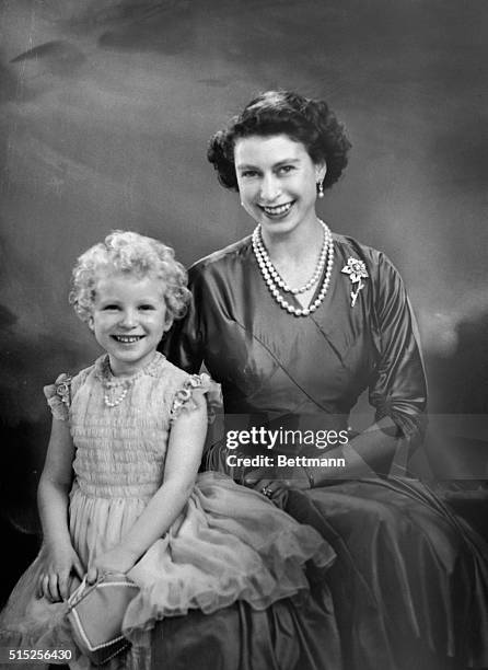 Photo shows Queen Elizabeth II as the picture of an adoring mother, posing with her daughter, Princess Anne, in this portrait.