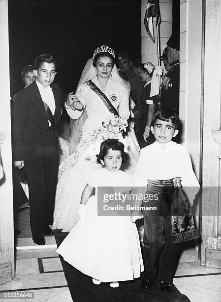 Princess Dina, daughter of Prince Abdel-Hamid of Hijaz, and bride of King Hussein is shown here with Crown Prince Mohammed during her wedding in...