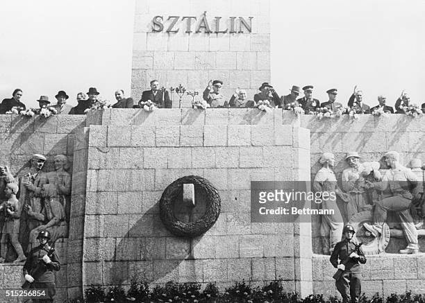 Red Mark "Liberation" Budapest: From the Stalin monument in Budapest Communist officials watch a parade marking the tenth anniversary of Hungary's...