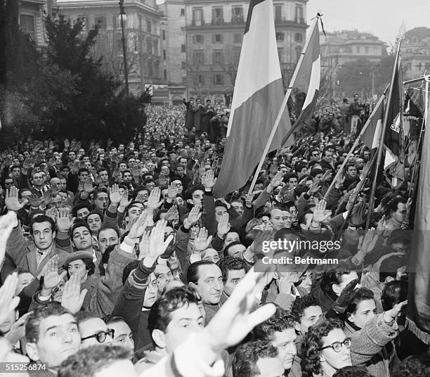 Crowd of 50,000 fascists, gathered in Rome's Piazza Ungheria, give the Fascist salute as the coffin of Rodolfo Graziani, former Marshal of Italy, is...