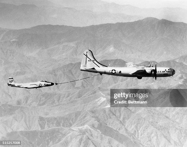 Midair Refueling. Japan: A U.S Navy F2H-3 Banshee jet plane of the VC-3 Squadron, operating from the USS Wasp with the Seventh fleet, is refueled by...