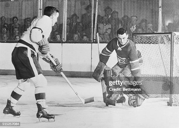 Detroit: An Old Habit. Ted Lindsay , of the Detroit Red Wings watches the puck , go in past goalie Jacques Plante of the Montreal Canadiens, scoring...