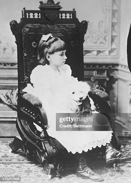 Keeper Of The Flame: In 1887, at the age of seven, Helen Keller looked like this, as she sat quietly with a pet dog she could feel, but couldn't see...