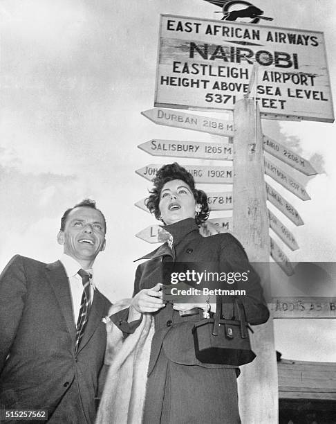 With Poppa There's Who's Afraid of Mau Mau? Nairobi, Kenya Colony, Africa: Frank Sinatra and his actress wife, Ava Gardner, stand by a well-fingered...