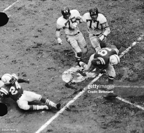 Baltimore Colts' Quarterback, Johnny Unitas , scoring a touchdown from the Giants' three-yard line in the fourth quarter of the NFL Championship...