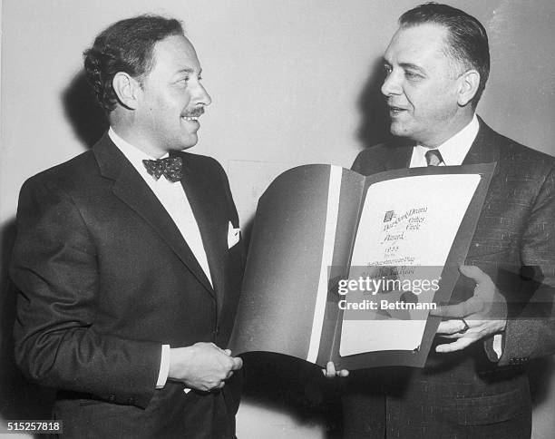 Walter F. Kerr , President of the Drama Critics' Circle, presents author Tennessee Williams with the Circle's award for his "Cat on A Hot Tin Roof,"...