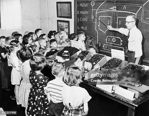 Exciting Day in the First Grade. Williamsport, Pennsylvania: Children at the Sheridan School get a treat as Howard "Pop" Miller, the janitor, shows...