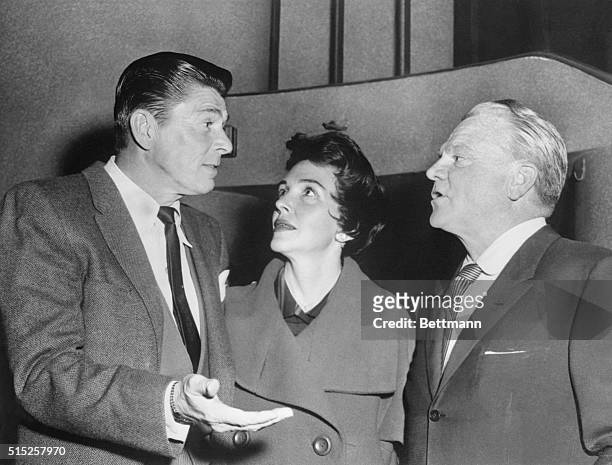 Screen Actor Guild president Ronald Reagan discusses SAG issues with Mrs. Reagan and actor James Cagney at the Screen Actors Guild rally at the...