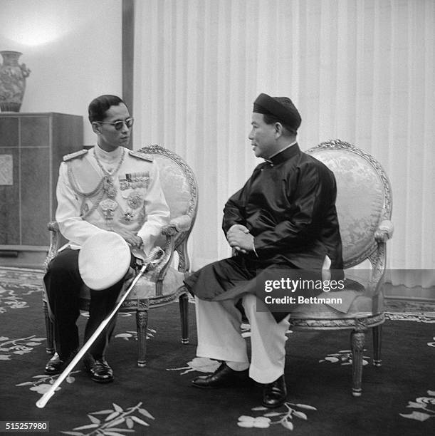 King of Thailand Visits Vietnam. Saigon, South Vietnam: King Phumiphol Aduldej of Thailand, left, talking with President Ngo Dinh Diem of Vietnam at...