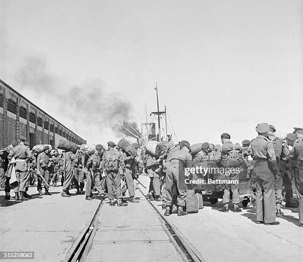 Haifa, Palestine: "Tommy Atkins" Starts To Leave Palestine. Troops of the 66th antitank regiment and the 33rd airbourne regiment are shown as they...