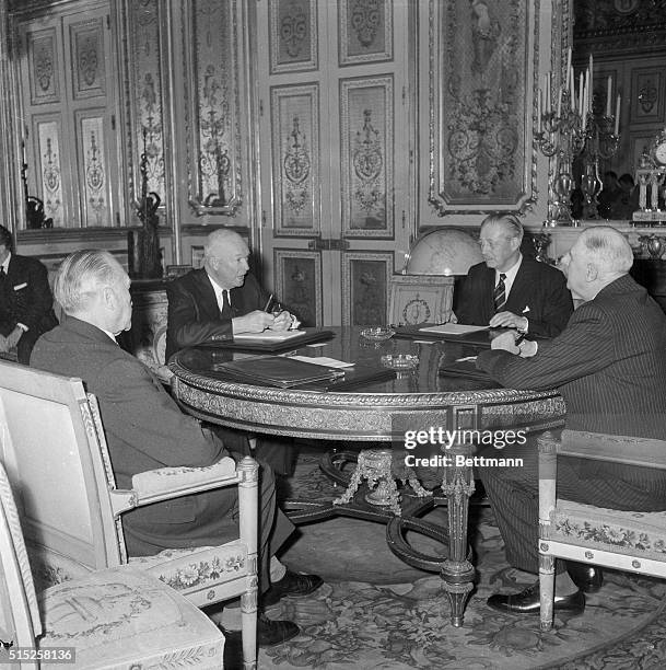 Western Summit meeting here around table in Elysee Palace shows, left to right, German Chancellor Konrad Adenauer, President Eisenhower, British...