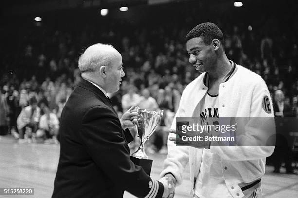 Cincinnati basketball ace Oscar Robertson is shown after landing his team to the championship of the Holiday Festival basketball tourney here, Dec....