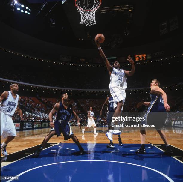 Kelvin Cato of the Orlando Magic makes a layup during a preseason game against the Memphis Grizzlies at TD Waterhouse Centre on October 12, 2004 in...