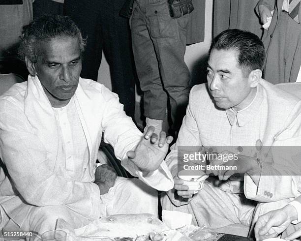 Bandung: Menon To Go To Red China. On the last day of the Bandung conference, Red China's Premier Chou en Lai , has a lunchtime meeting with India's...