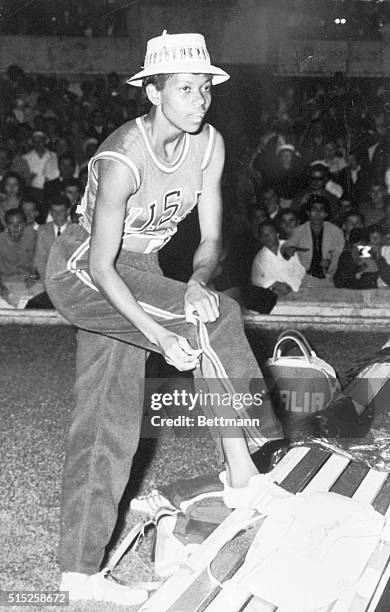 Track sensation Wilma Rudolph gets dressed after winning her third Olympic gold during the 1960 Olympic Games.