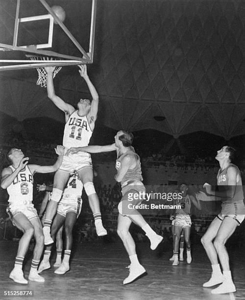 The United States beat Italy 88-54 in tonight's Olympic Basketball Elimination Round Game. Here are T. Dischinger and J. Lucas of the United States...