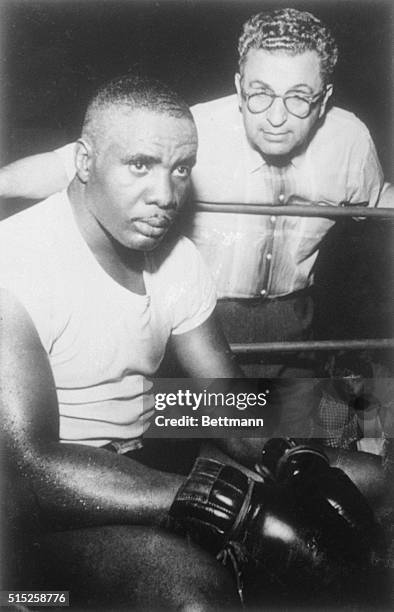 Lightweight Sonny Liston and his manager "Pep" Barone. He will be fighting Eddie Machen at Seattle Sick's Stadium, rain or shine, September 7th....