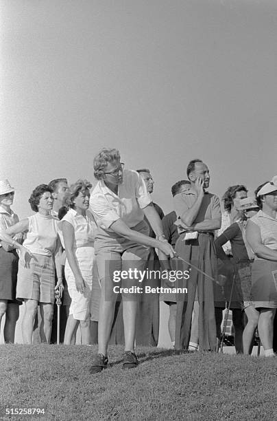 All eyes are one the ball after a shot by Mickey Wright, of San Diego, California, in the first annual $7,500 Grossinger's women's open golf...