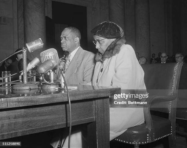 Mrs. Annie Lee Moss, who was named as a "card carrying" Communist in 1944 and currently employed in the pentagon's code room, is shown with her...
