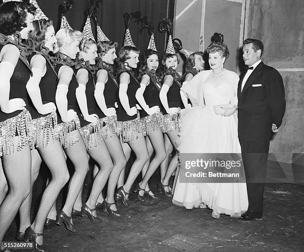 The popular comedy team, Lucille Ball and Desi Arnaz, whose film, The Long, Long Trailer, is shown at the Radio City Music Hall, are shown back stage...