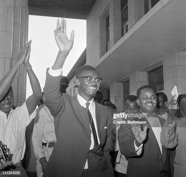 Wave of Confidence. Leopoldville, Congo: Flushed with victory, Congolese Premier Patrice Lumumba waves as he leaves the National Senate, Sept. 8th....