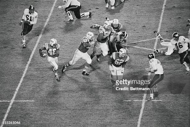 Boston: Boston Patriots halfback, Larry Garran , drives around his own right and for 5 yard gain in 1st period of Denver Bronco's, Patriot's game....