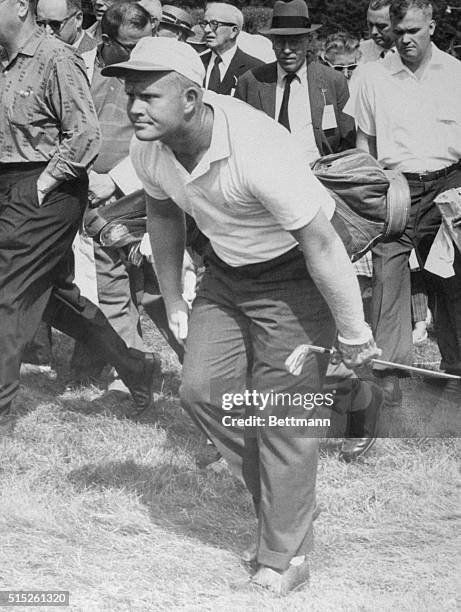 Jack Nicklaus strains forward apparently in hope that golf ball he just hit will drop where he wants it. It did, just like it has all week to bring...